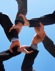 Group handshake representing a consortium